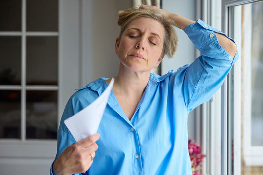 woman experiencing menopause symptoms