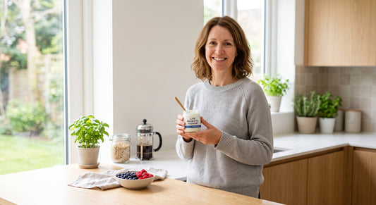 Woman with live yoghurt and probiotic supplement for women's health support