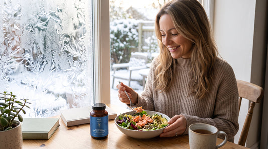 Woman caring for her skin during winter with natural, nutrient-rich foods nearby