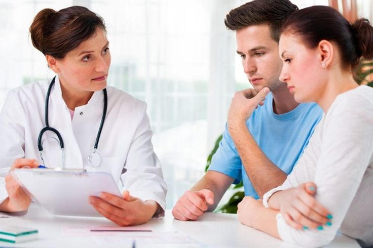 Couple sitting together, discussing fertility and trying to conceive